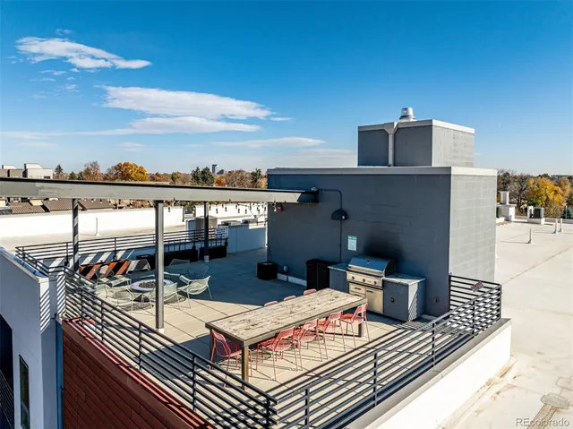 a bedroom with furniture and a chandelier