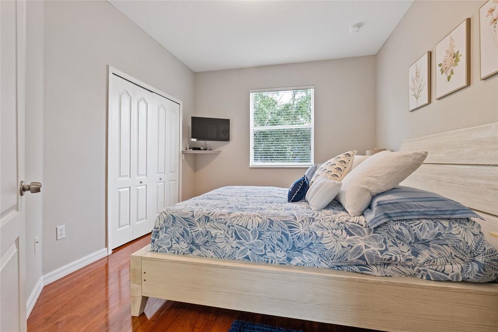 10475 Manderley Way Orlando, FL 32829 - Photo 17 of 31 a bed sitting in a bedroom next to a window