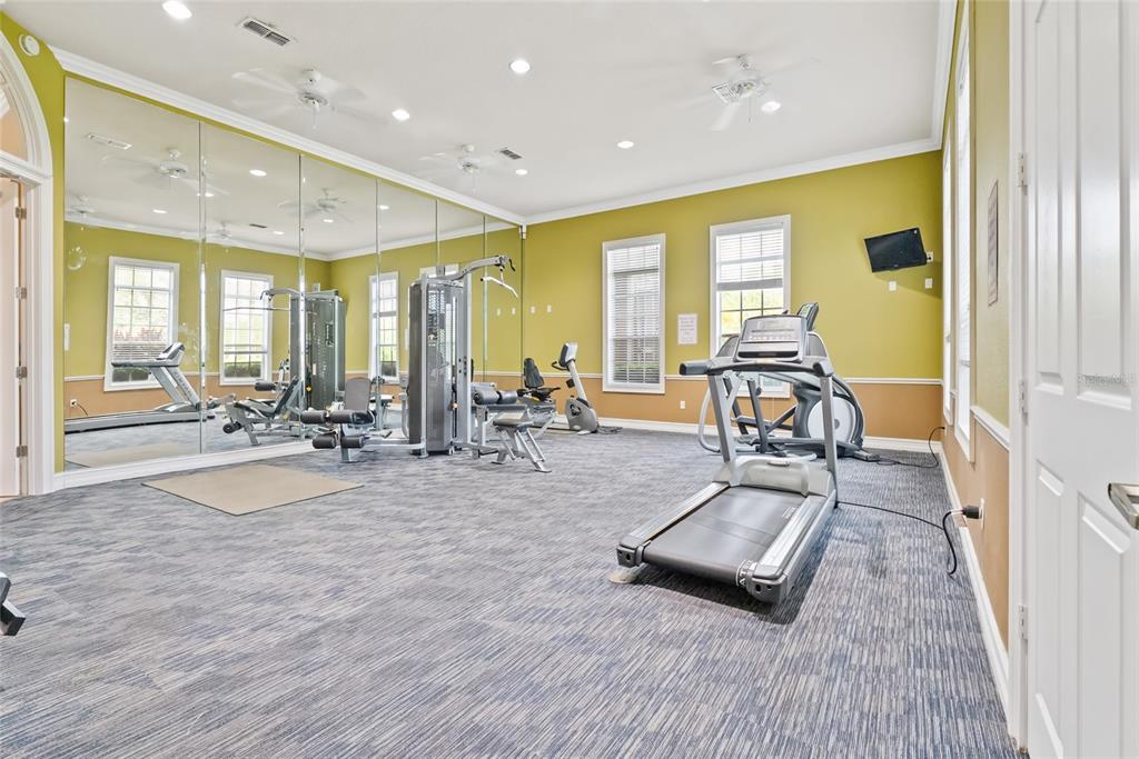 10475 Manderley Way Orlando, FL 32829 - Photo 26 of 31 a view of a room with gym equipment