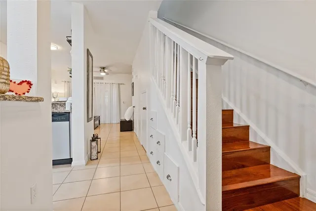 a kitchen with white cabinets stainless steel appliances and sink