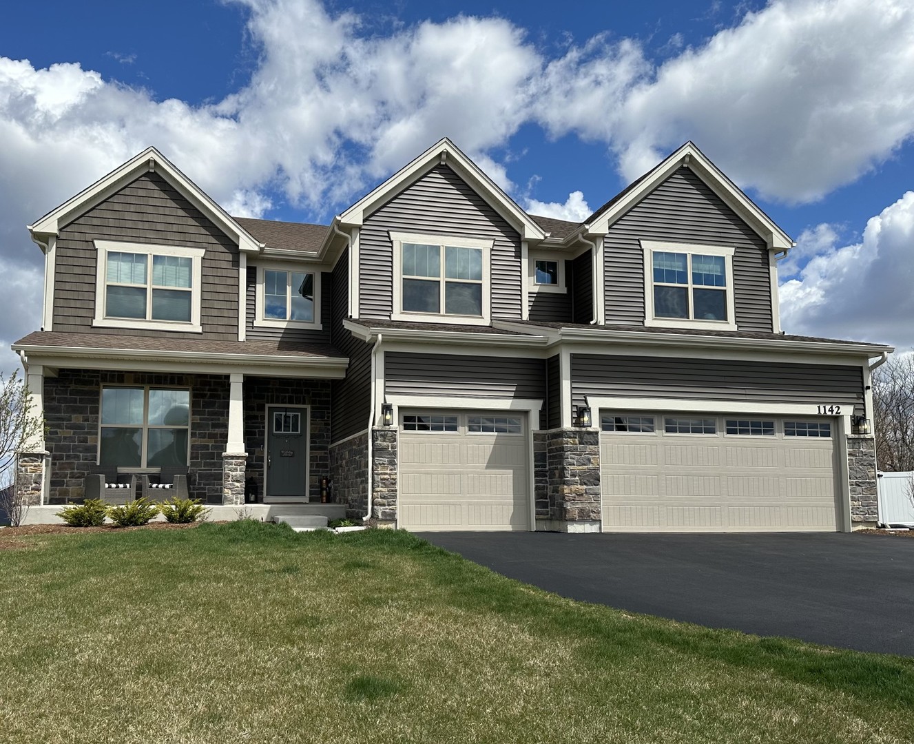1142 Glengary Court Crystal Lake, IL 60012 - Photo 1 of 24 a front view of a house with a yard and garage