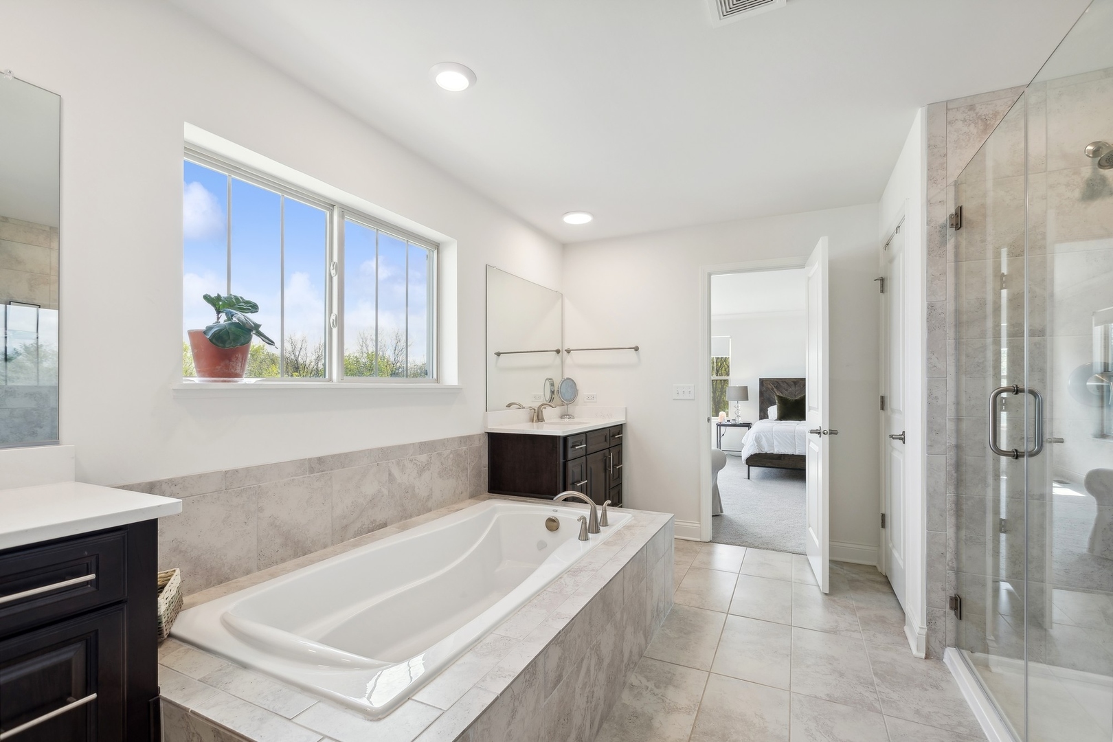 1142 Glengary Court Crystal Lake, IL 60012 - Photo 15 of 24 a bathroom with a tub a sink and a shower