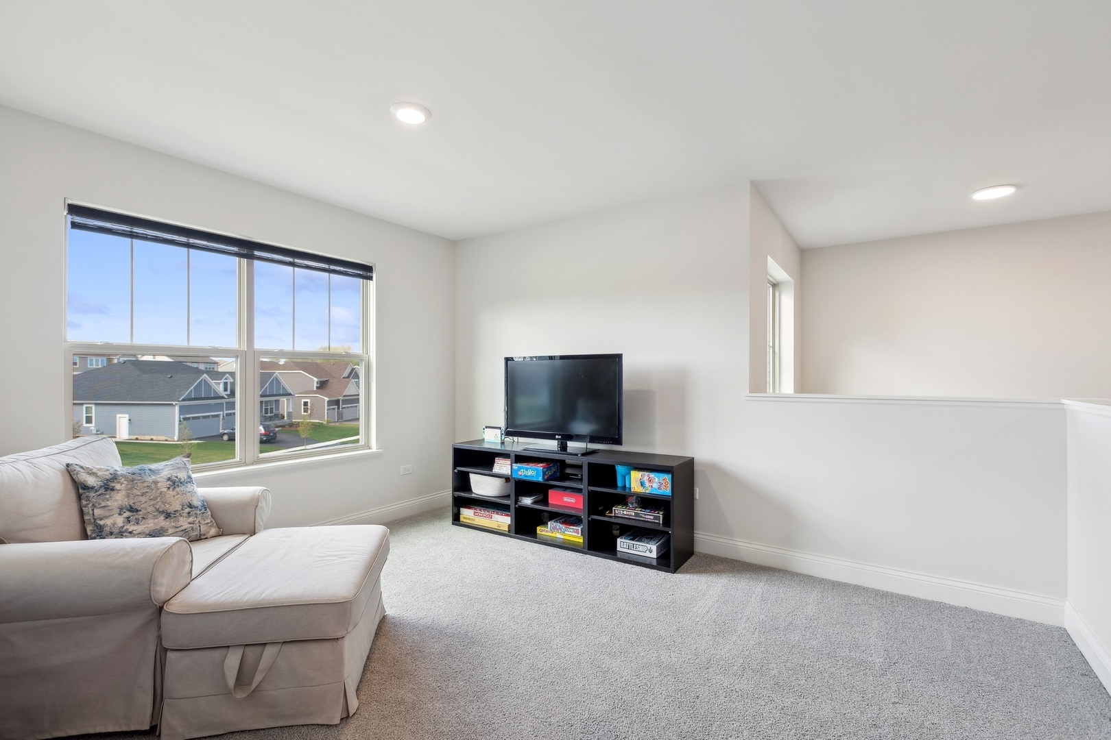 1142 Glengary Court Crystal Lake, IL 60012 - Photo 10 of 24 a living room with furniture and a flat screen tv