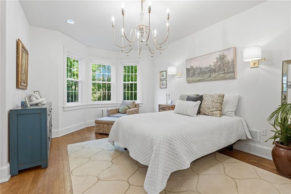 3944 Bakerstown Road Gibsonia, PA 15044 - Photo 32 of 50 a spacious bedroom with a bed and wooden floor