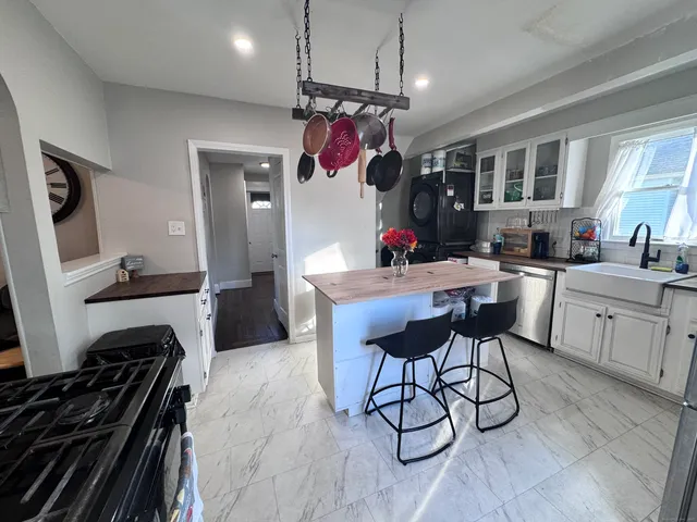 a kitchen with a table and chairs in it