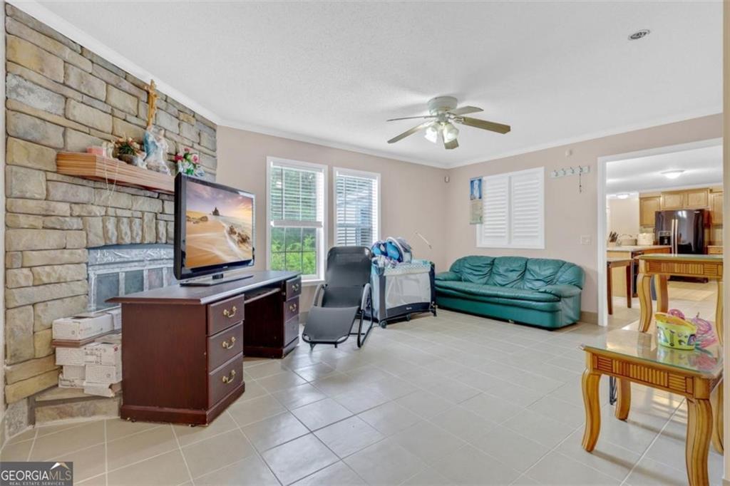 397 Reed Brawner Road Royston, GA 30662 - Photo 14 of 35 a living room with furniture and a flat screen tv