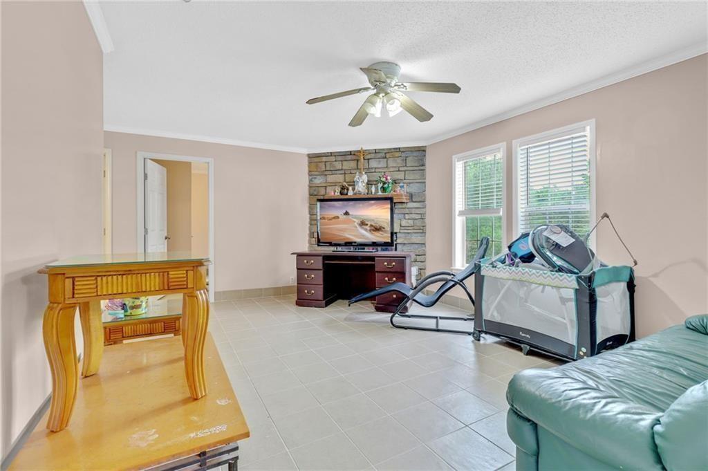 397 Reed Brawner Road Royston, GA 30662 - Photo 15 of 33 a living room with furniture and a flat screen tv