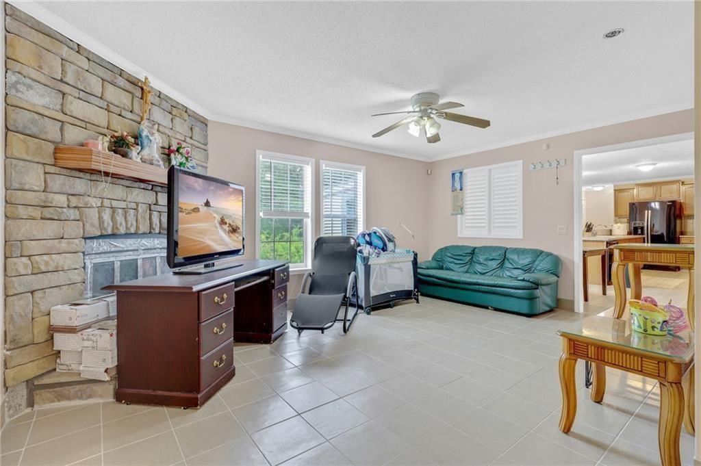 397 Reed Brawner Road Royston, GA 30662 - Photo 16 of 33 a living room with furniture and a flat screen tv