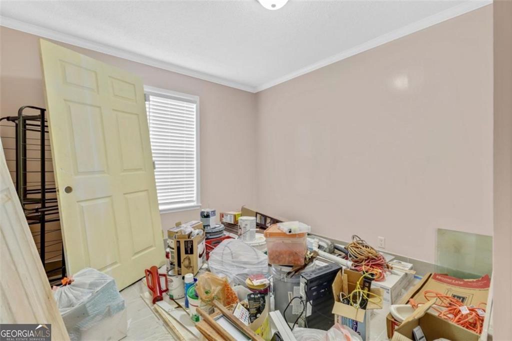 397 Reed Brawner Road Royston, GA 30662 - Photo 16 of 35 a bed sitting in a bedroom next to a window