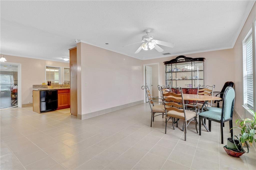 397 Reed Brawner Road Royston, GA 30662 - Photo 6 of 33 a view of a dining room with furniture and a chandelier
