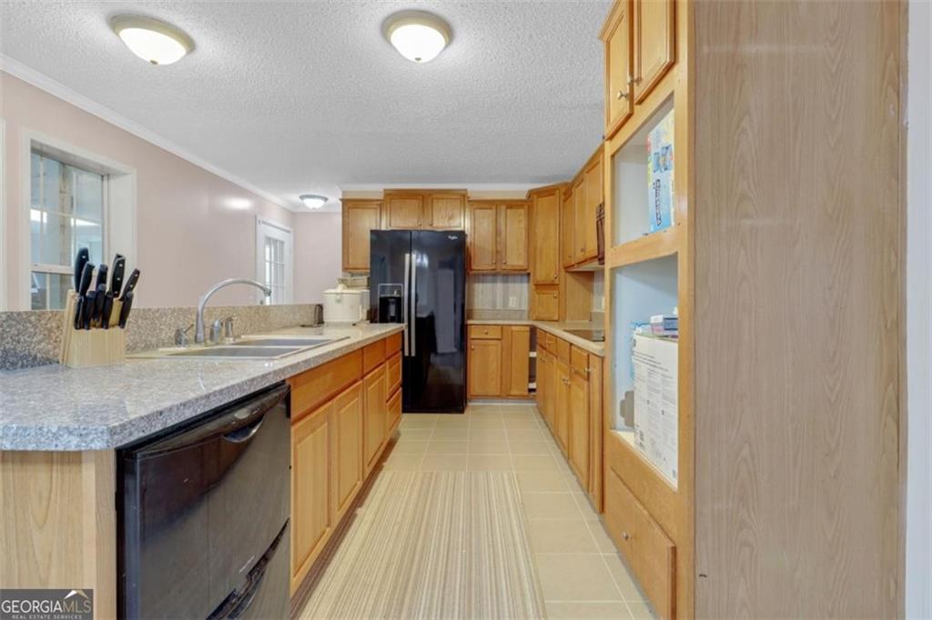 397 Reed Brawner Road Royston, GA 30662 - Photo 8 of 35 a bathroom with a granite countertop sink and a large mirror