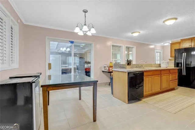 a kitchen with stainless steel appliances granite countertop a sink counter space and cabinets