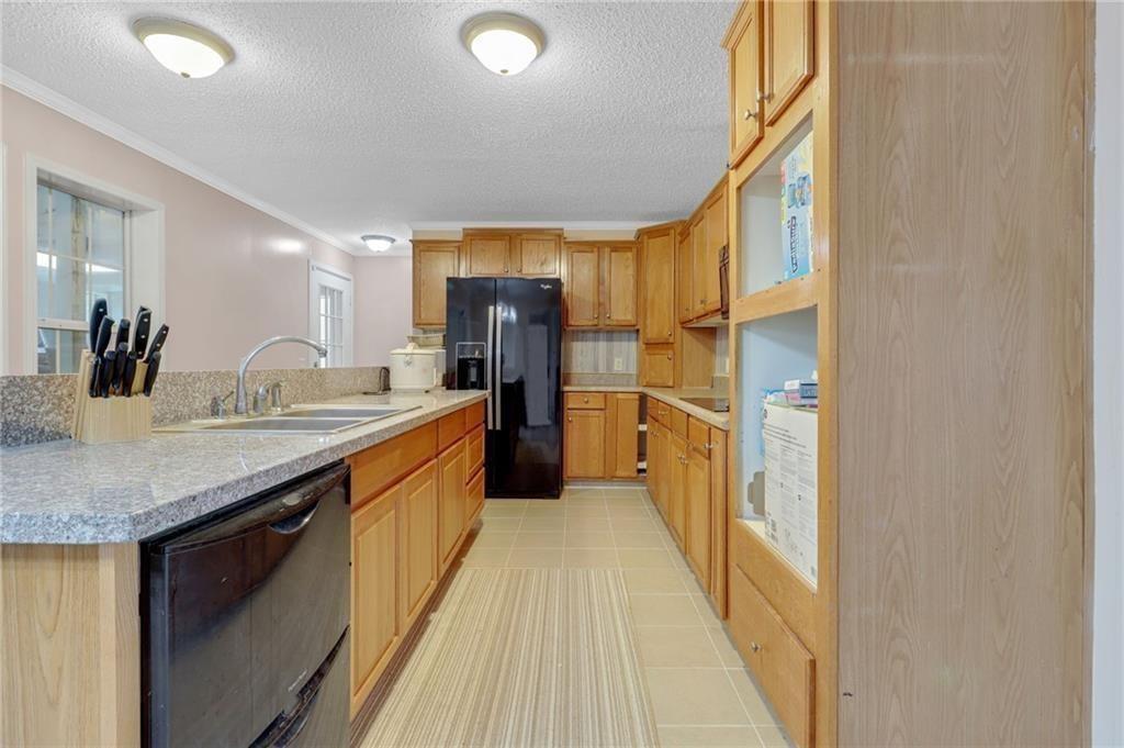 397 Reed Brawner Road Royston, GA 30662 - Photo 10 of 33 a bathroom with a granite countertop sink and a large mirror