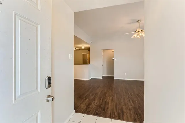 a view of a bathroom with a sink and a mirror