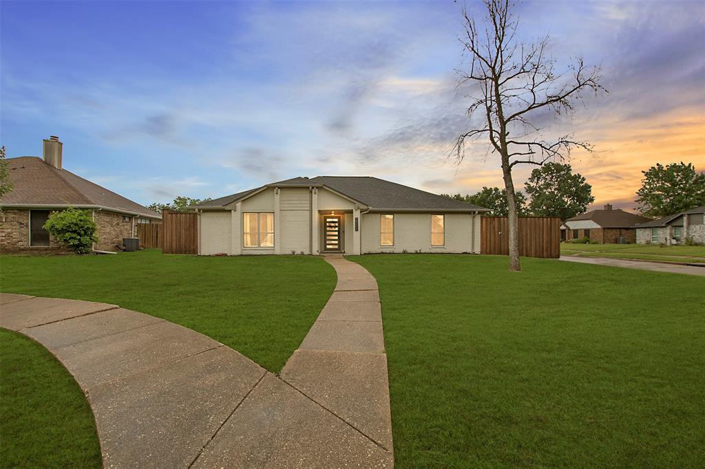 View of front of home featuring brick siding