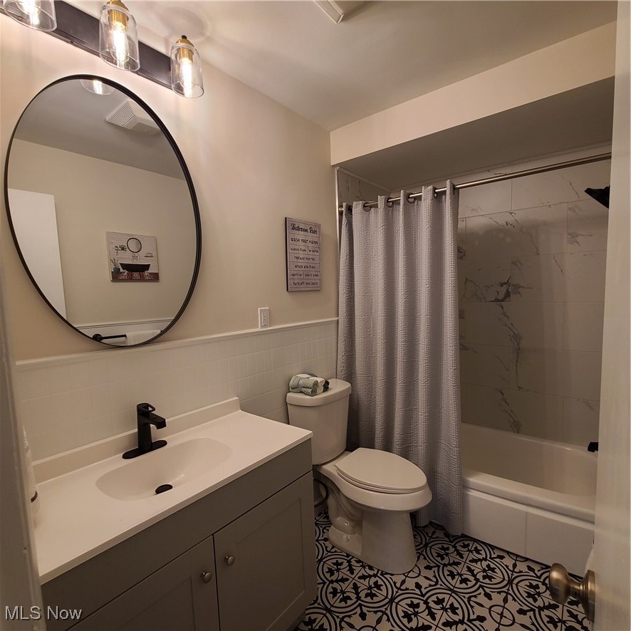 12204 Grannis Road Garfield Heights, OH 44125 - Photo 6 of 22 Main bathroom updated with new vanity, lighting and toilet