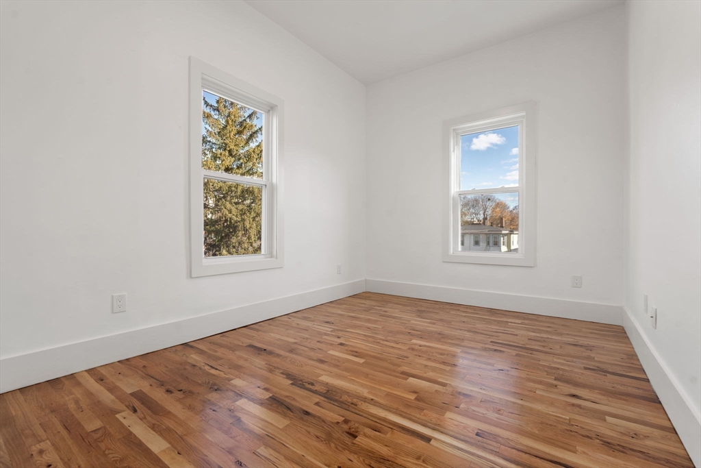 120 Regent Street, Unit 5 Boston, MA 02119 - Photo 12 of 27 an empty room with windows