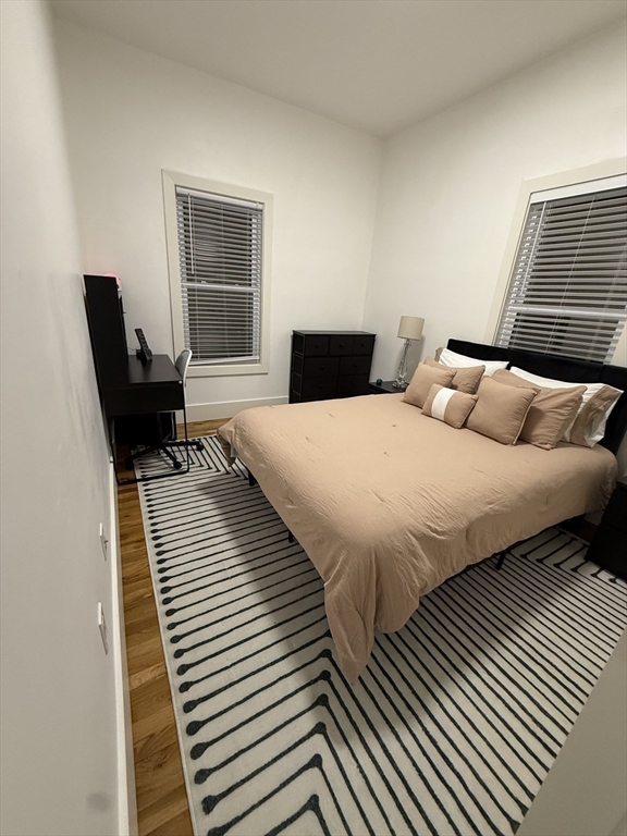 120 Regent Street, Unit 5 Boston, MA 02119 - Photo 19 of 27 a bedroom with double bed and a window