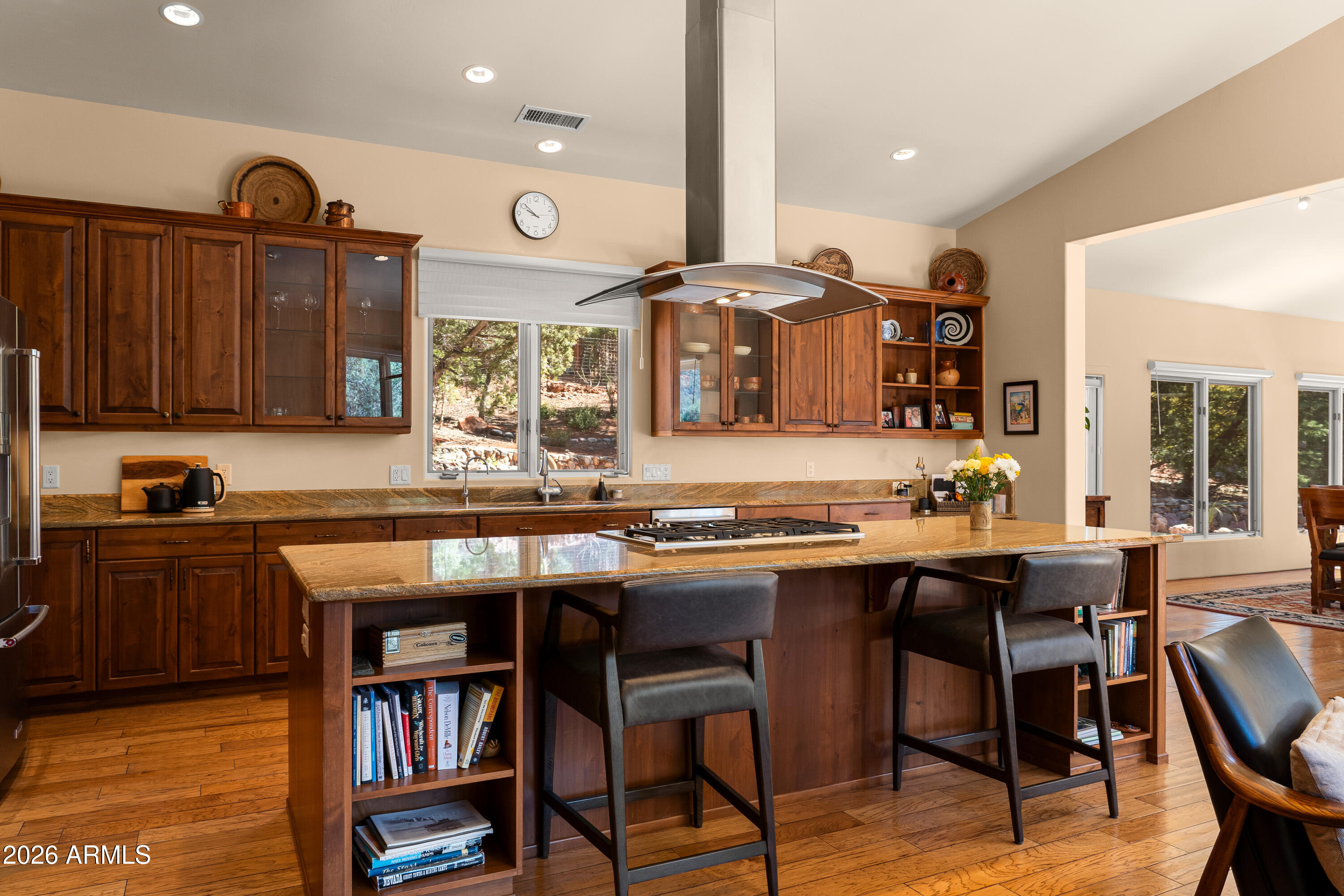190 Morgan Road Sedona, AZ 86336 - Photo 27 of 51 a kitchen with a table chairs stove and cabinets