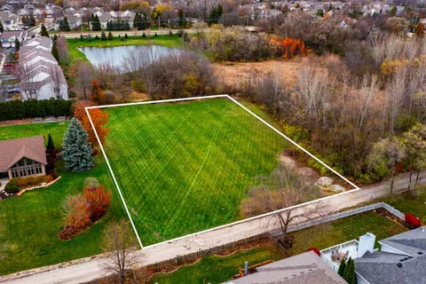 a view of a backyard with a lake view