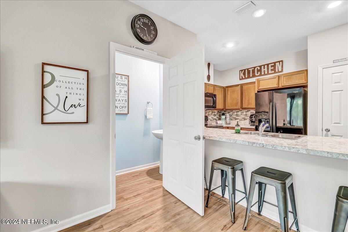 183 Silver Fern Drive St. Augustine, FL 32086 - Photo 13 of 29 a kitchen with a table and chairs