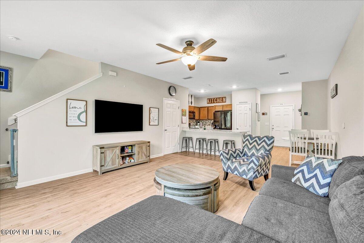 183 Silver Fern Drive St. Augustine, FL 32086 - Photo 15 of 29 a living room with furniture and a flat screen tv