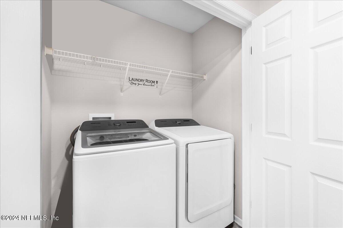 183 Silver Fern Drive St. Augustine, FL 32086 - Photo 27 of 29 a utility room with dryer and washer