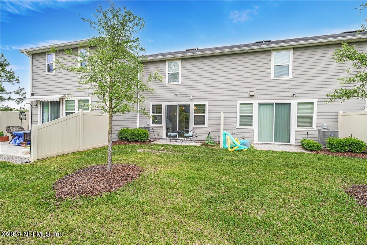 183 Silver Fern Drive St. Augustine, FL 32086 - Photo 29 of 29 front view of a house with a yard