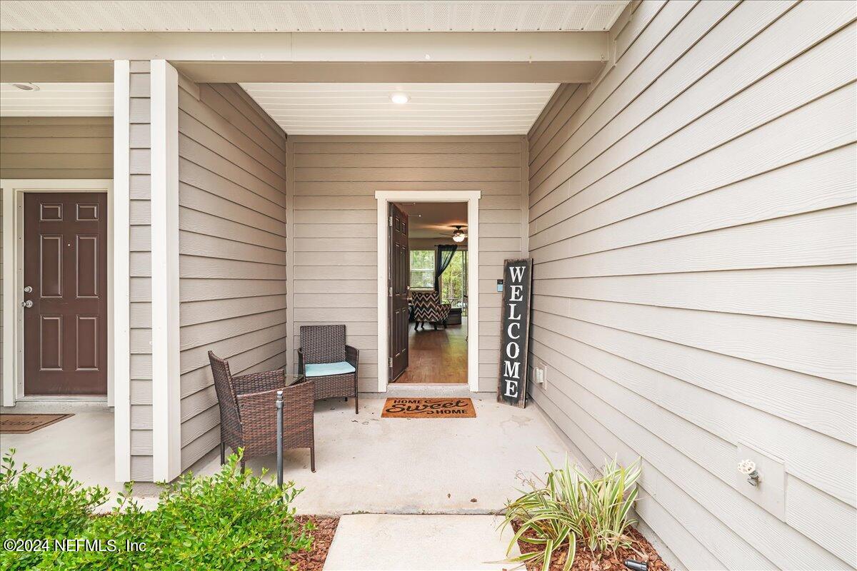 183 Silver Fern Drive St. Augustine, FL 32086 - Photo 4 of 29 a porch with seating space
