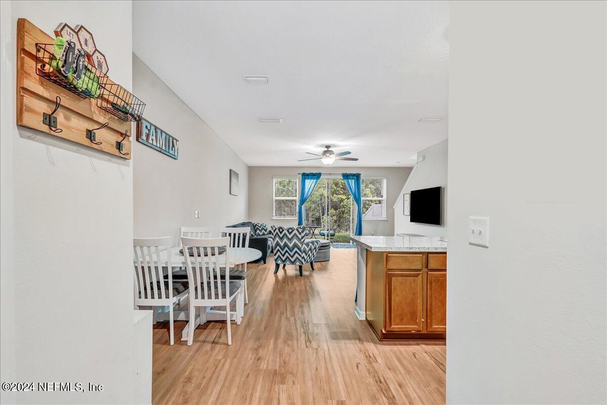 183 Silver Fern Drive St. Augustine, FL 32086 - Photo 5 of 29 a view of a dining room with furniture window and wooden floor
