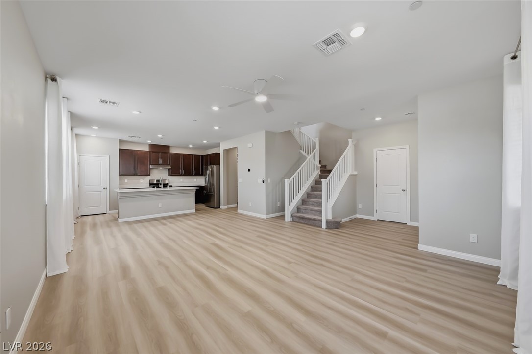 3564 Credere Lane Henderson, NV 89074 - Photo 2 of 40 Unfurnished living room with light wood-style floors, recessed lighting, and ceiling fan