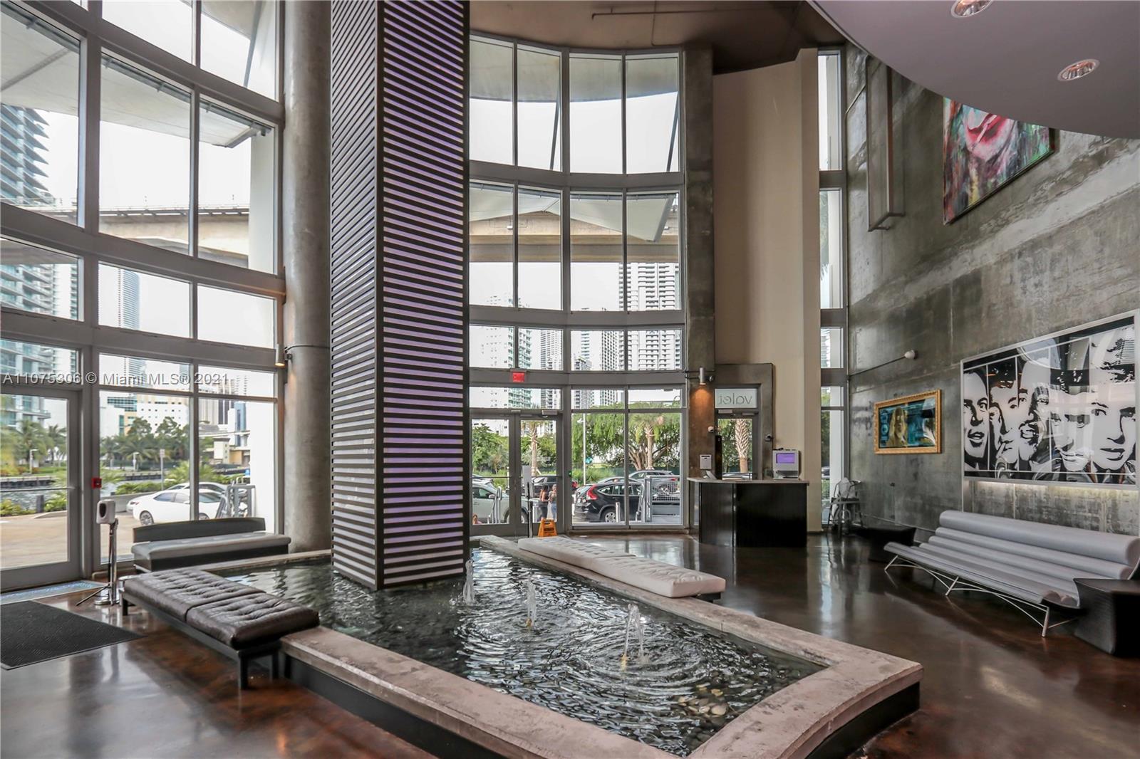 690 Southwest 1st Court, Unit 1715 Miami, FL 33130 - Photo 29 of 42 a living room with furniture and a window