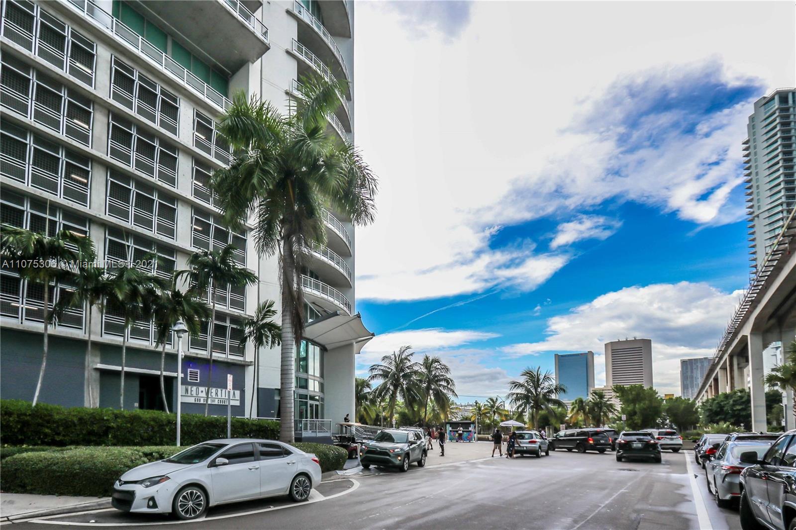 690 Southwest 1st Court, Unit 1715 Miami, FL 33130 - Photo 42 of 42 a couple of cars parked in front of a building