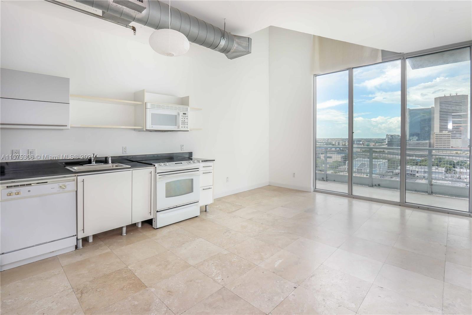 690 Southwest 1st Court, Unit 1715 Miami, FL 33130 - Photo 6 of 42 a view of a kitchen with electric appliances