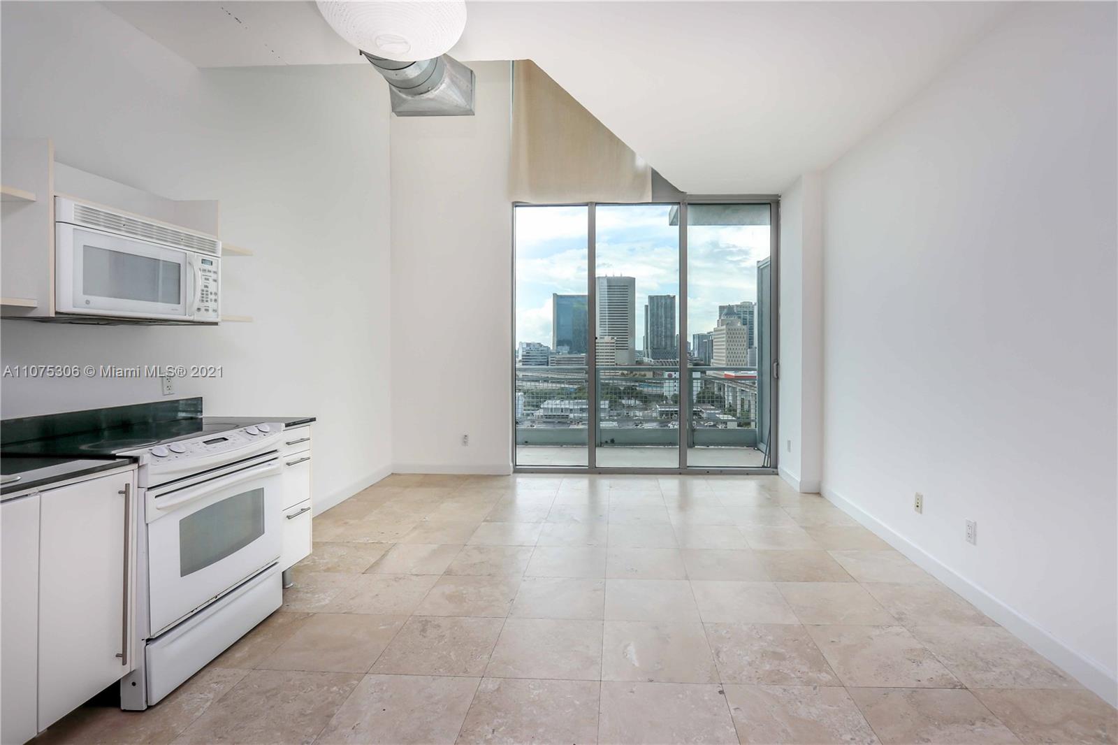 690 Southwest 1st Court, Unit 1715 Miami, FL 33130 - Photo 7 of 42 a view of a kitchen with electric appliances
