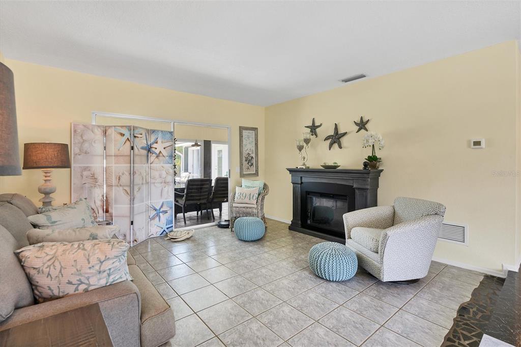 245 Spaniards Road Placida, FL 33946 - Photo 19 of 65 a living room with furniture and a fireplace