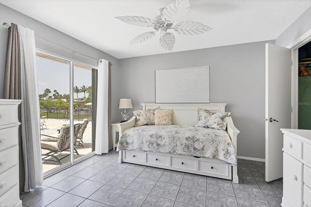 245 Spaniards Road Placida, FL 33946 - Photo 31 of 65 a bedroom with a bed and a chandelier