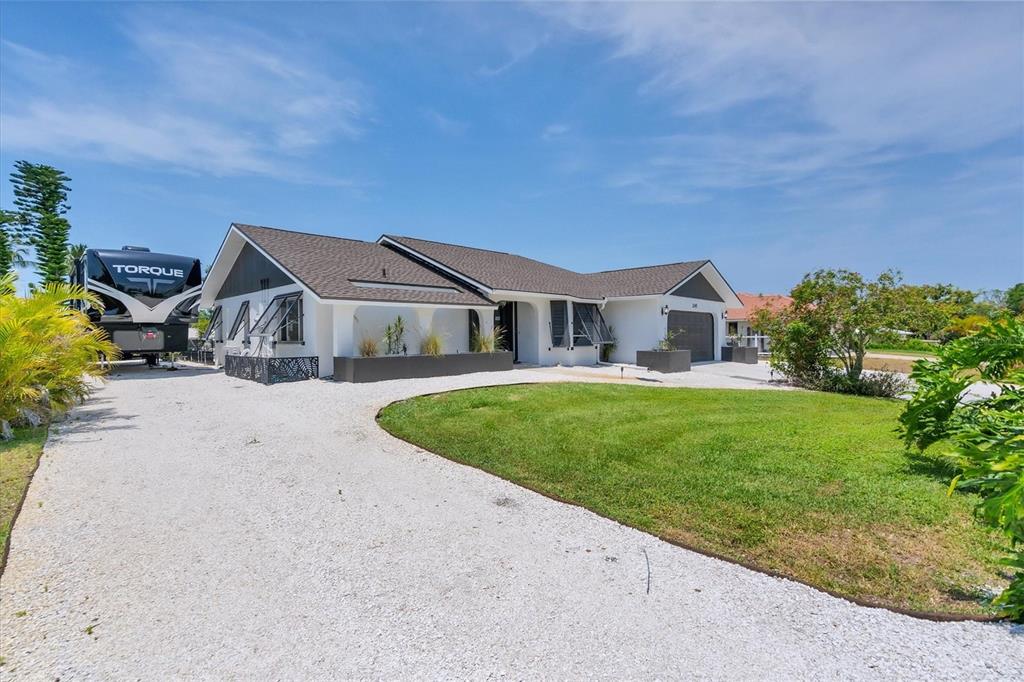 245 Spaniards Road Placida, FL 33946 - Photo 4 of 65 a view of house and outdoor space