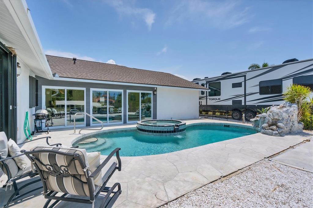 245 Spaniards Road Placida, FL 33946 - Photo 44 of 65 a view of a house with backyard sitting area and garden