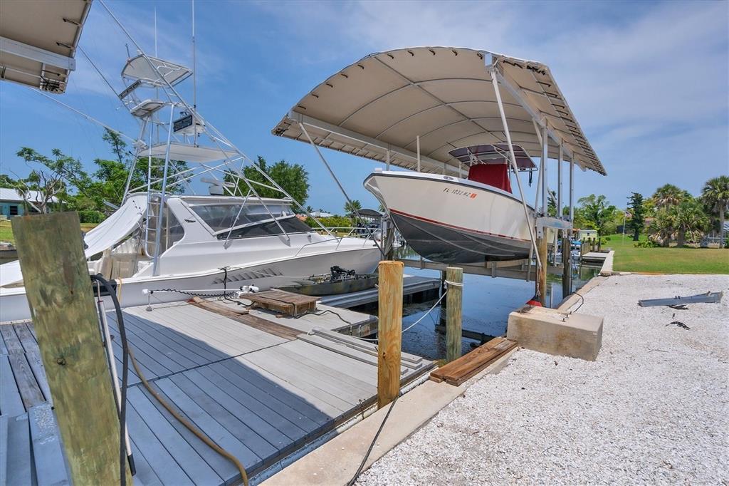 245 Spaniards Road Placida, FL 33946 - Photo 51 of 65 a view of a roof deck with chair and tables