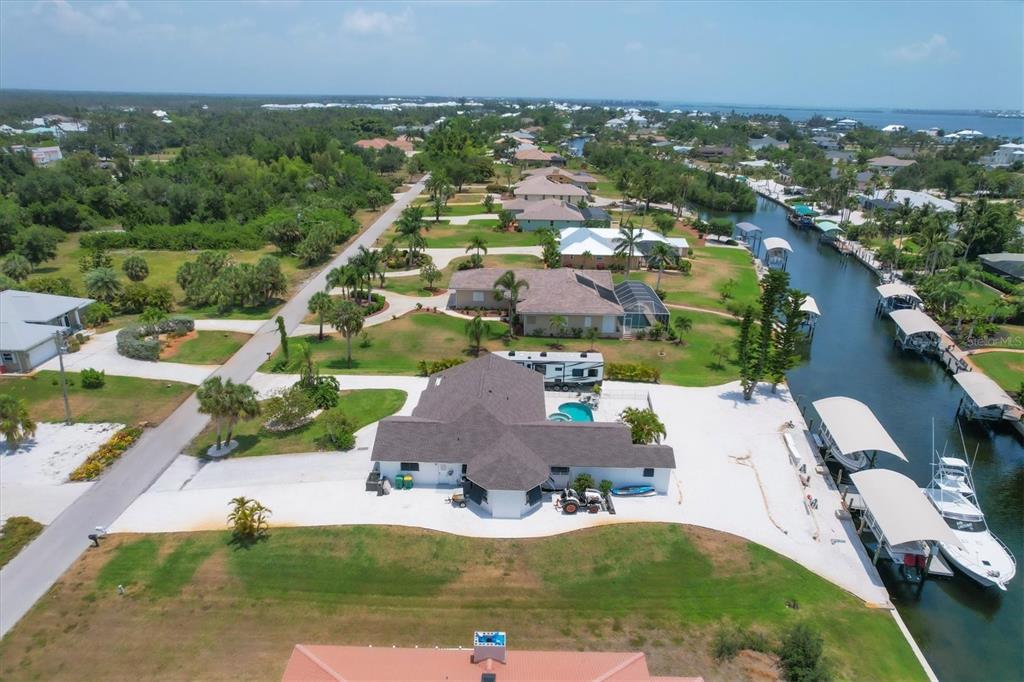 245 Spaniards Road Placida, FL 33946 - Photo 57 of 65 an aerial view of residential houses with outdoor space and parking