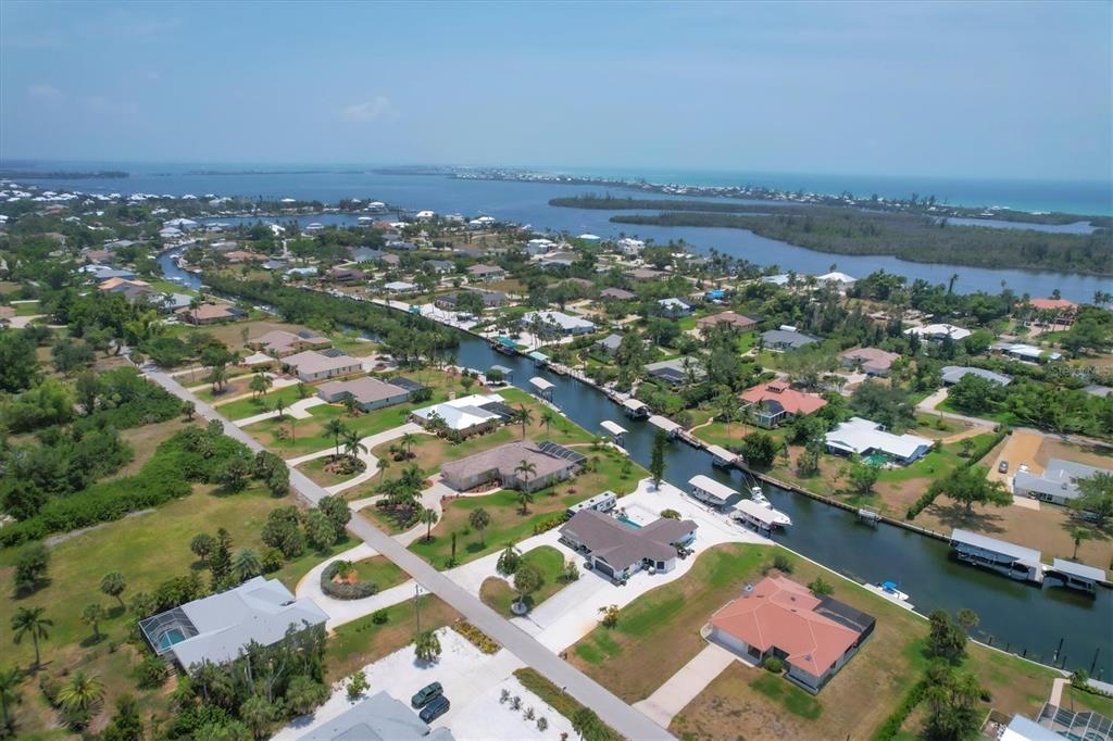 245 Spaniards Road Placida, FL 33946 - Photo 59 of 65 an aerial view of residential houses with outdoor space and river