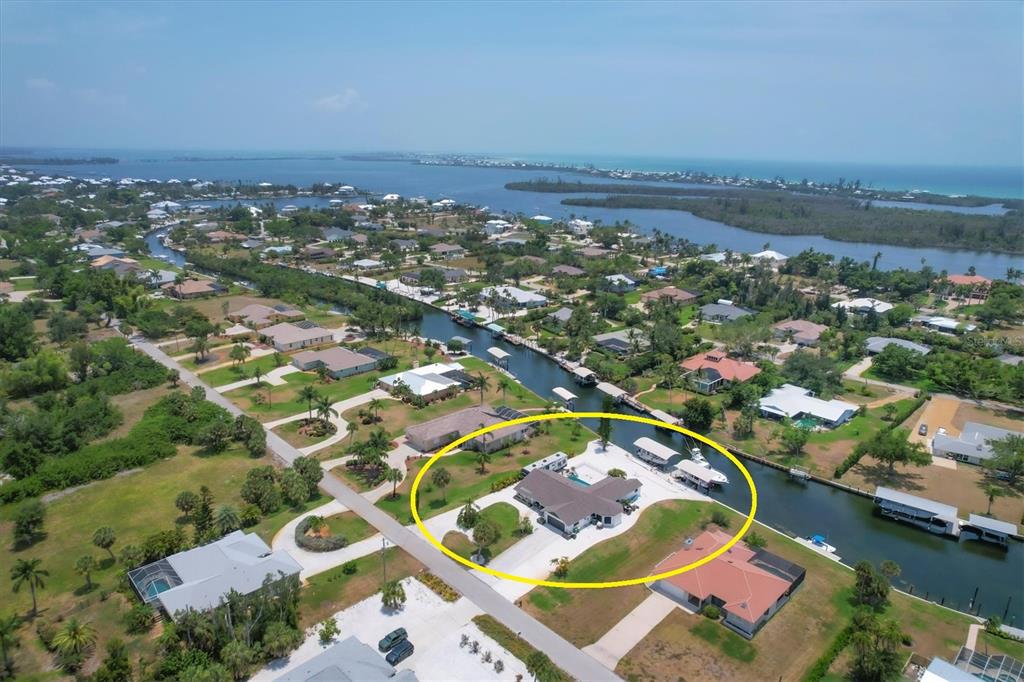245 Spaniards Road Placida, FL 33946 - Photo 65 of 65 an aerial view of residential houses with outdoor space and river