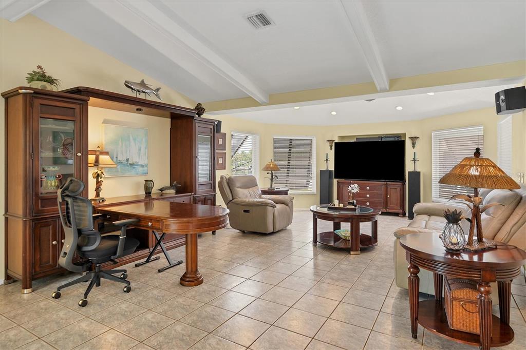 245 Spaniards Road Placida, FL 33946 - Photo 7 of 65 a living room with furniture and a flat screen tv