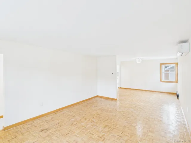 a bedroom with a large bed and a dresser