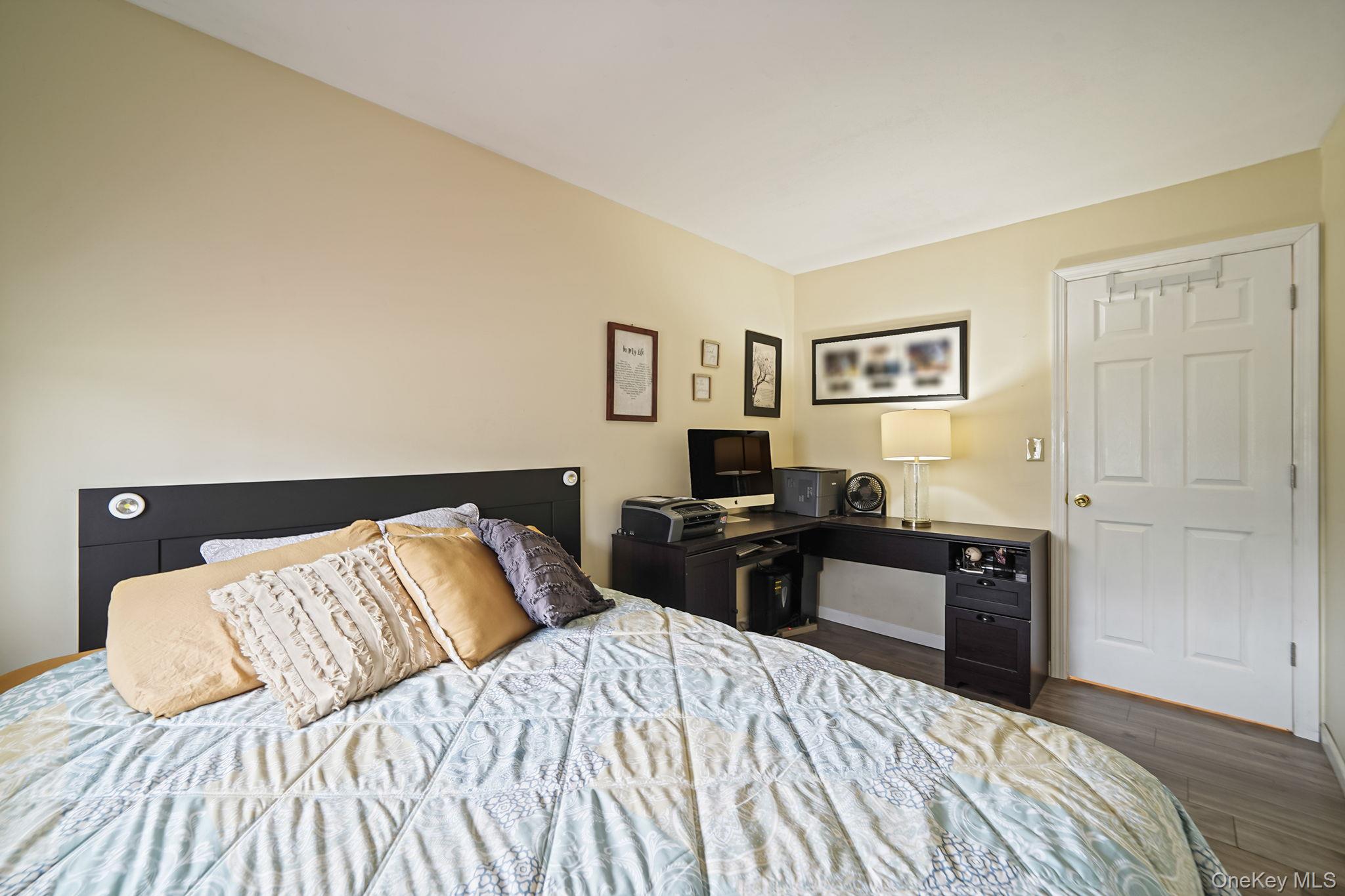 11 Nehring Avenue Babylon, NY 11702 - Photo 16 of 27 a bedroom with a bed and dresser