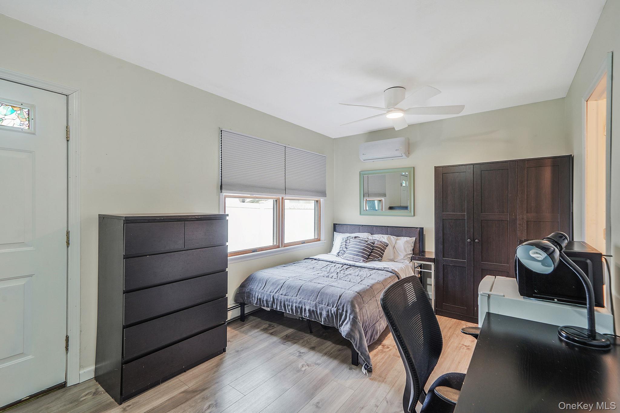 11 Nehring Avenue Babylon, NY 11702 - Photo 17 of 27 a bedroom with a bed and a table