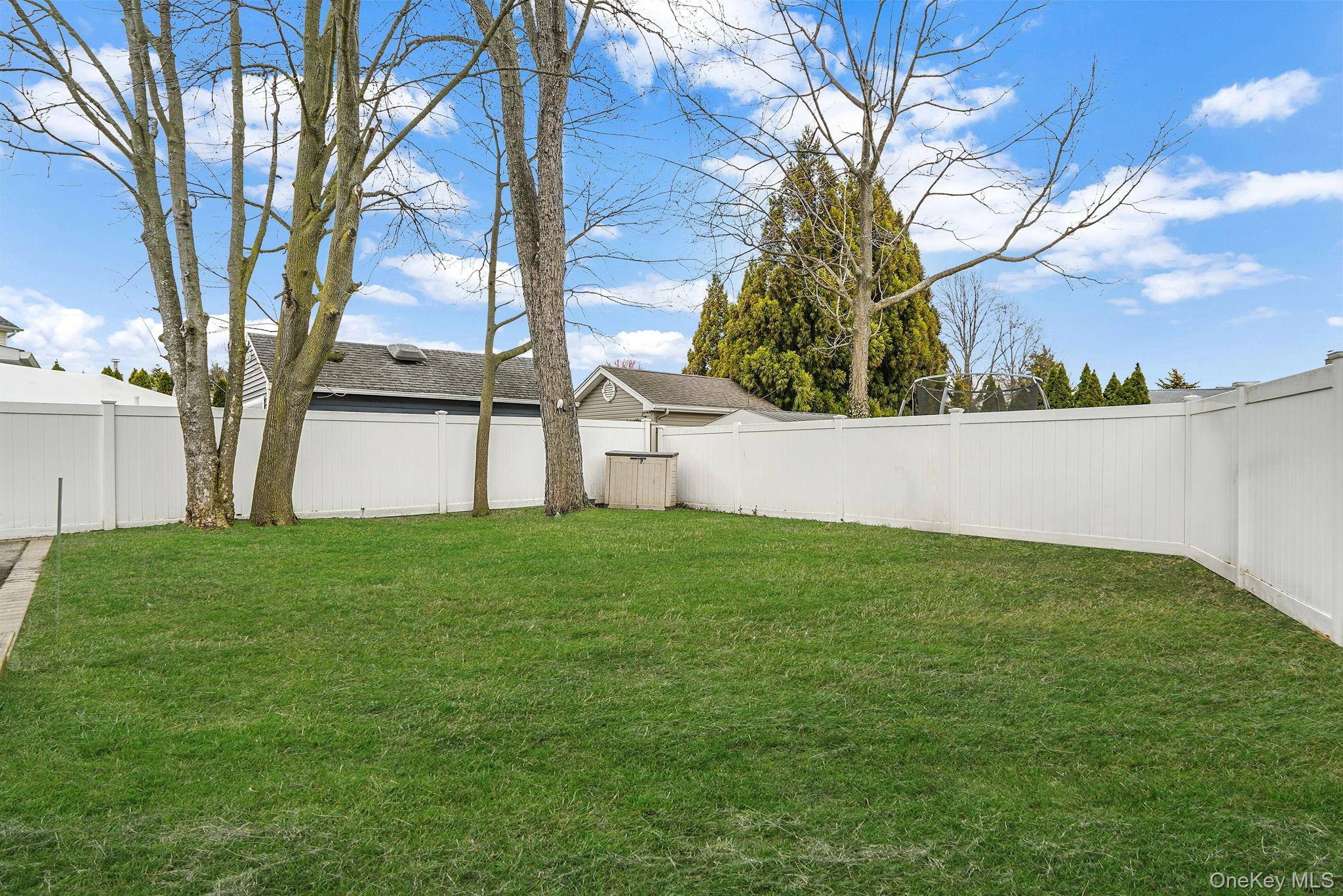 11 Nehring Avenue Babylon, NY 11702 - Photo 21 of 27 a view of a backyard with large trees