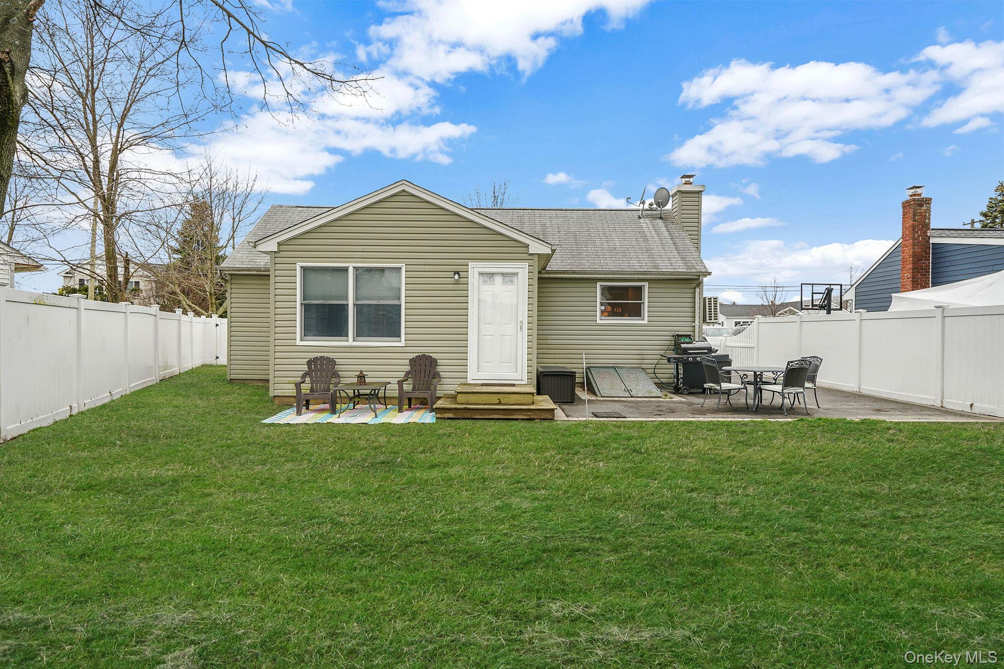 11 Nehring Avenue Babylon, NY 11702 - Photo 24 of 27 a view of a house with backyard and sitting area