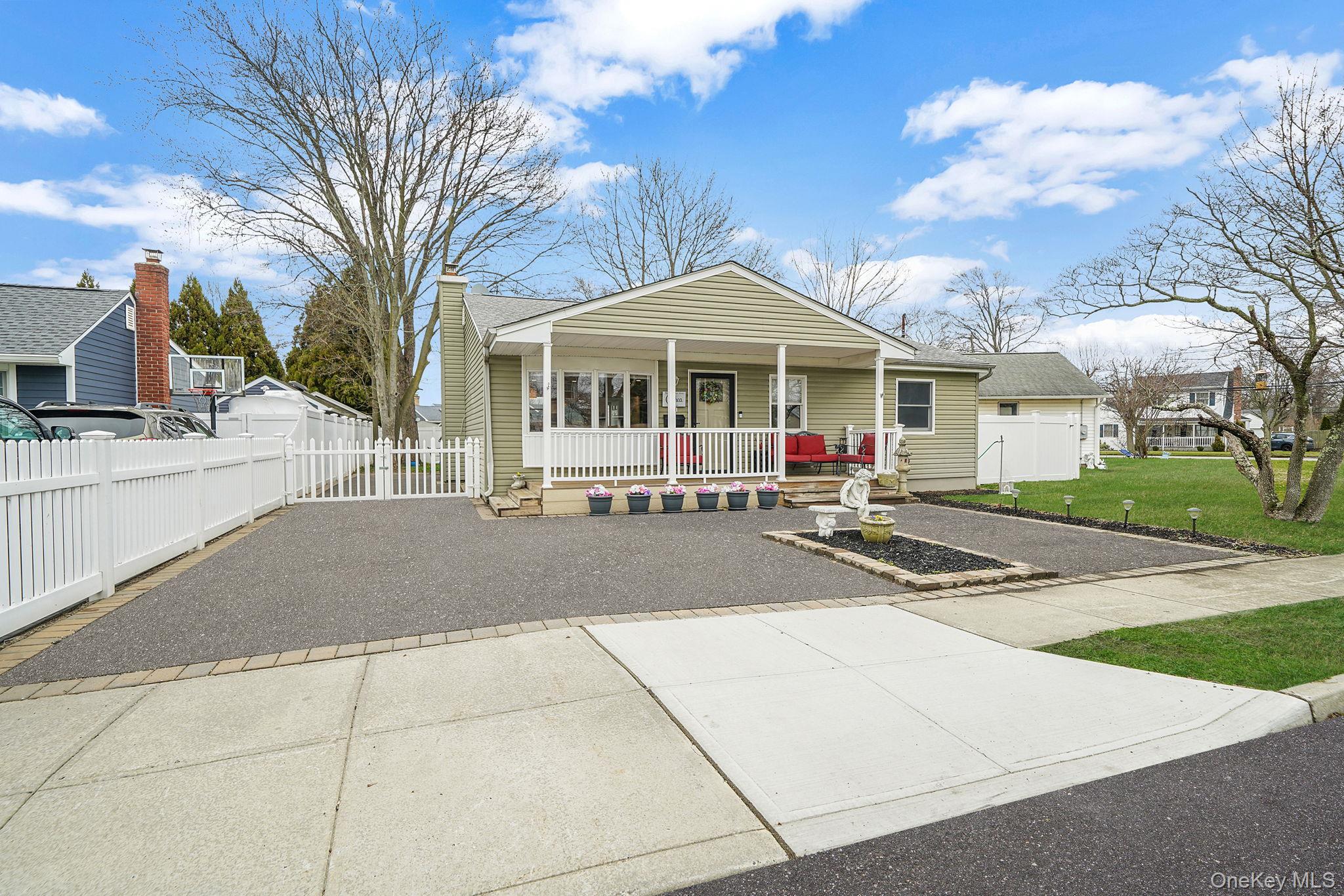 11 Nehring Avenue Babylon, NY 11702 - Photo 4 of 27 a front view of a house with yard and green space
